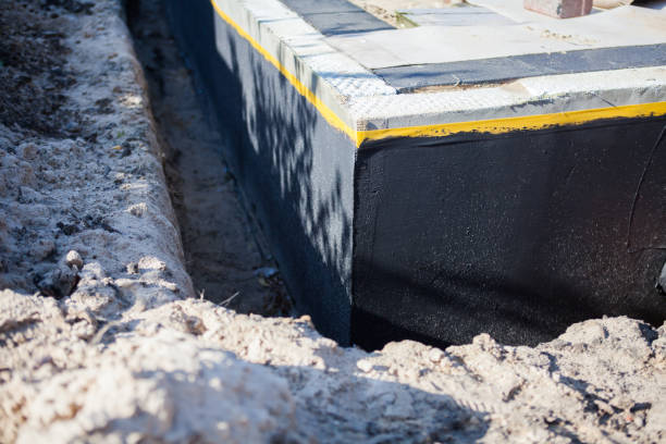 Professional Waterproofing technician working in Greenwood, SC